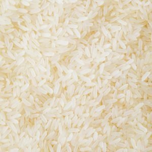 Close-up image of numerous white rice grains, showcasing texture and abundance.